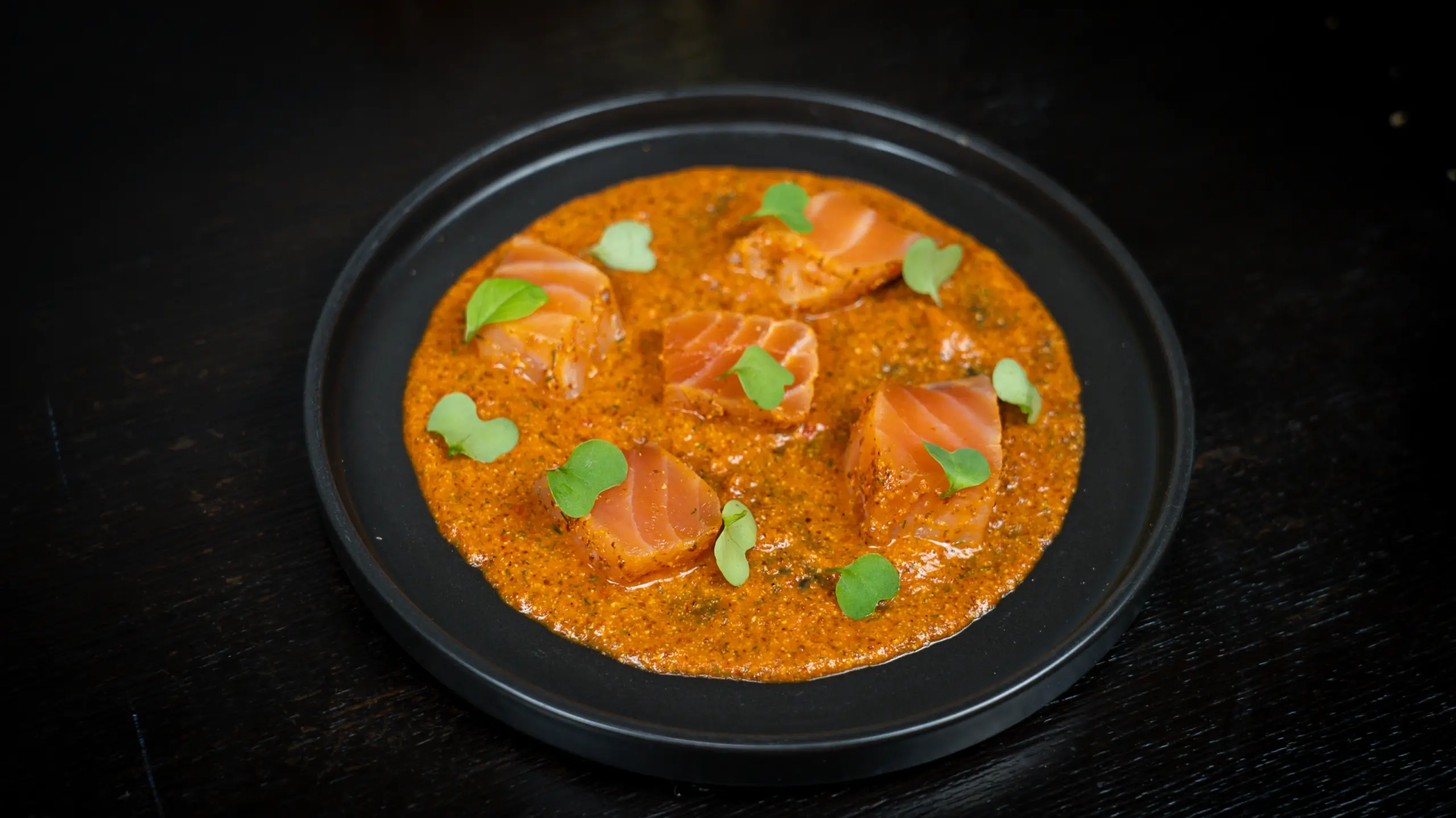 A picture of Salmon Gravlax with Whole Grain Mustard, Piquillos, Dill, Pink Peppercorn, & Gin