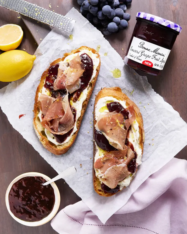 A picture of Prosciutto & Goat Cheese Toast with Concord Grape